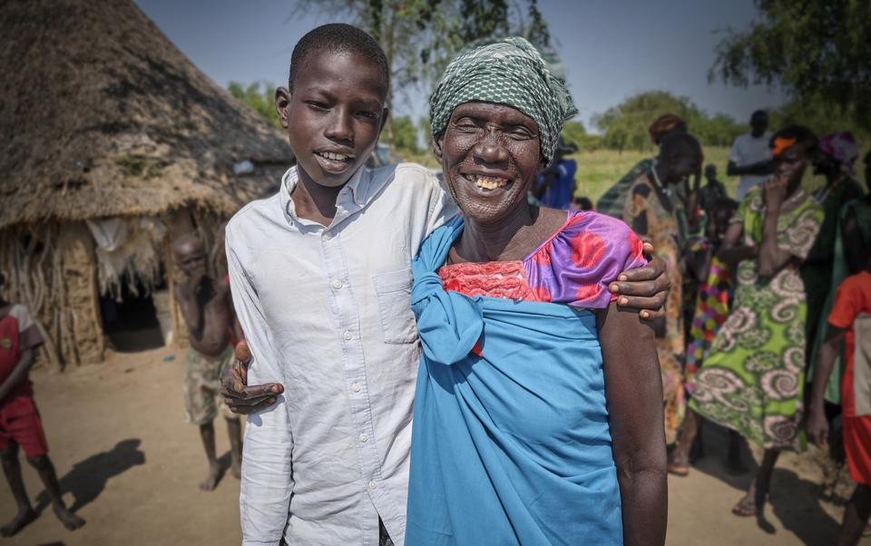Domaac*, 14, and his mother - Shelter For Kids Edit